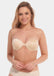 A woman wearing a latte Magical Strapless bra