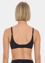Person wearing a black MAGIC Push-Up Bra on a white background