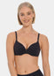 Woman wearing a black MAGIC Push-Up Bra against a plain background