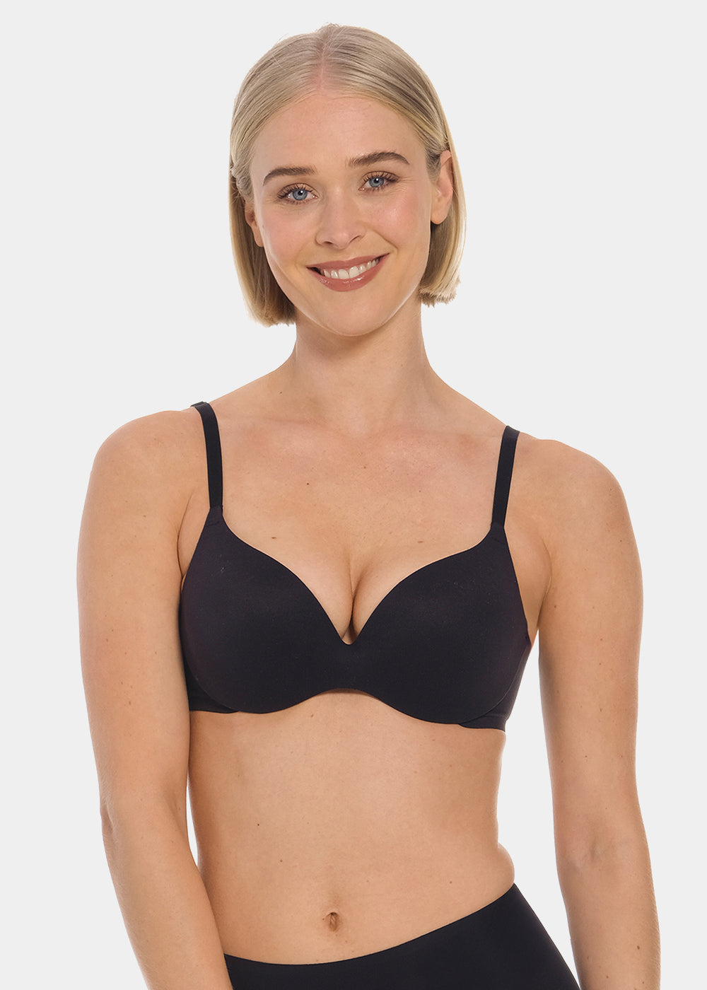 Woman wearing a black MAGIC Push-Up Bra against a plain background