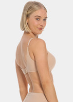 Woman wearing a cappuccino MAGIC Push-Up Bra on a white background