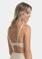 This image features the V-Bra Lace, a stylish and functional bra designed with a deep plunge neckline and an extra low back, making it invisible under sheer tops and dresses. The bra is beautifully crafted with intricate lace and mesh details, adding a touch of elegance.