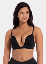 This image features a model wearing a V-Bra, which is designed to be nearly invisible under clothing with low plunge necklines. The bra boasts a deep cleavage front and an extra low back, making it ideal for seamless coverage.