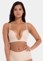 This image features a model wearing a V-Bra, which is designed to be nearly invisible under clothing with low plunge necklines. The bra boasts a deep cleavage front and an extra low back, making it ideal for seamless coverage.