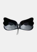 Inside of a black, backless, strapless adhesive bra with a drawstring front closure.