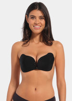 A woman wearing a black, backless, strapless adhesive bra with a drawstring front closure.