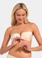 Woman wearing a rose strapless bra against a plain background