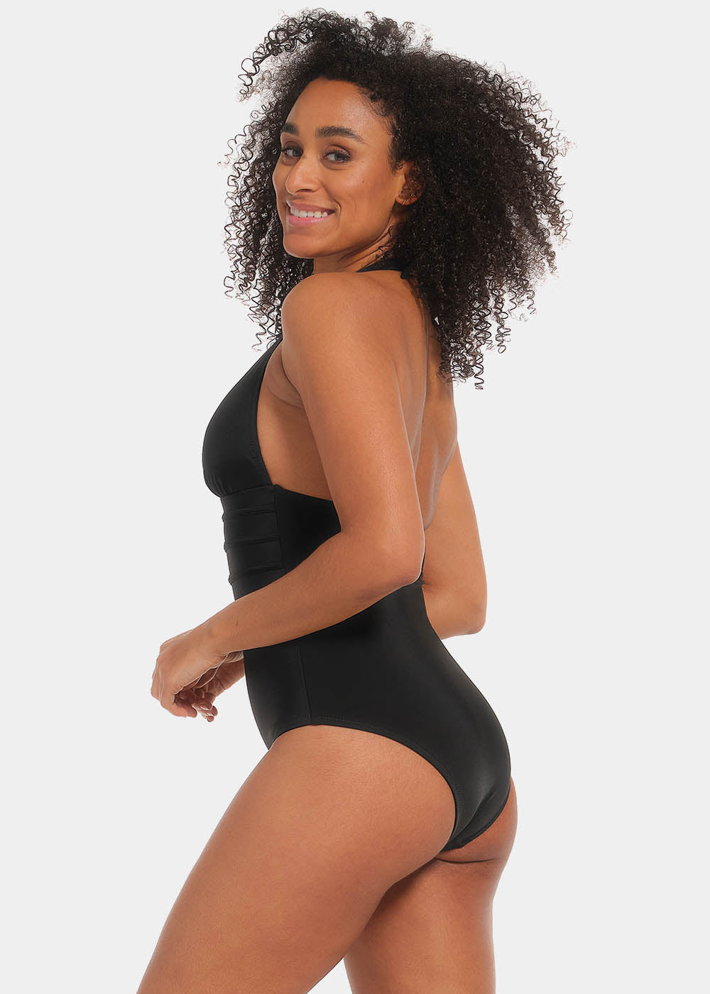 Woman wearing a black swimsuit with a plain background