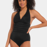 Woman wearing a black swimsuit against a white background