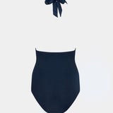 Navy blue swimsuit with a bow on a white background
