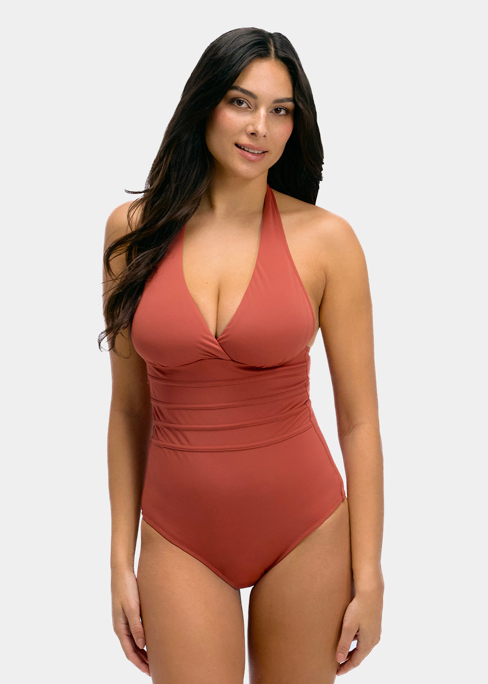 Woman wearing a sunset colored swimsuit on a white background