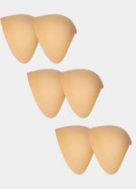 Set of beige silicone shoulderpads on a white background